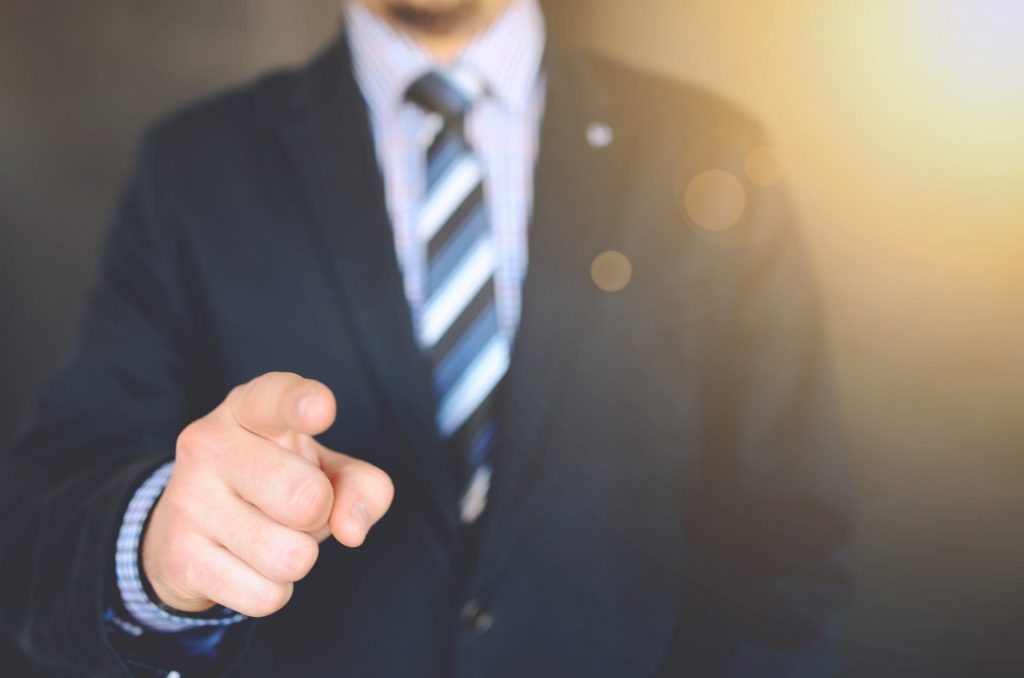 A man pointing at the camera representing how Warrington Removals Company puts your needs first.